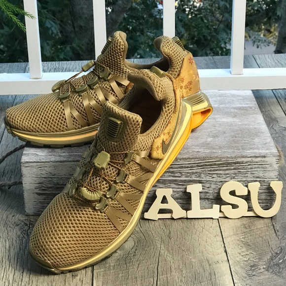 nike shox gravity women's gold
